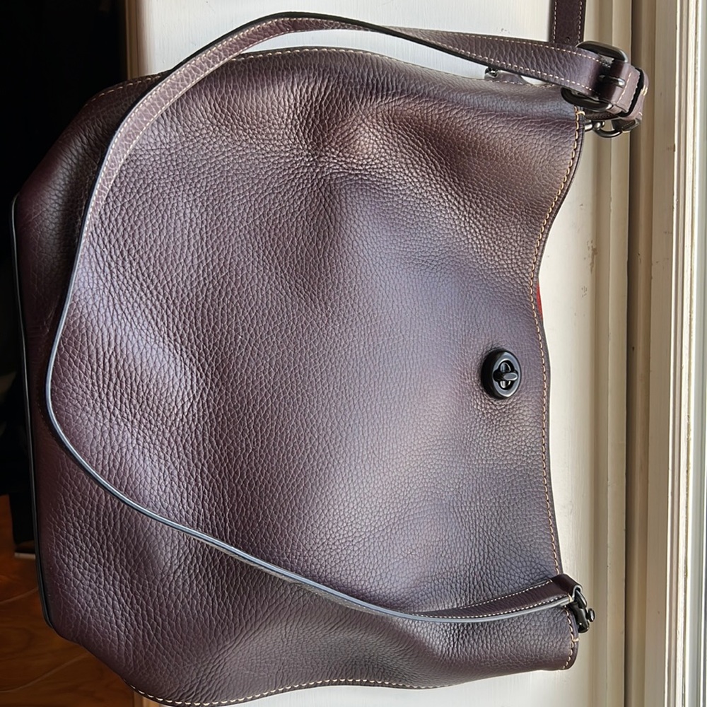 Coach leather duffle purse. Purple leather outer and red suede interior.